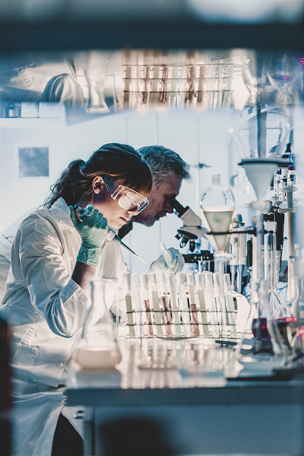 Health care researchers working in scientific laboratory.