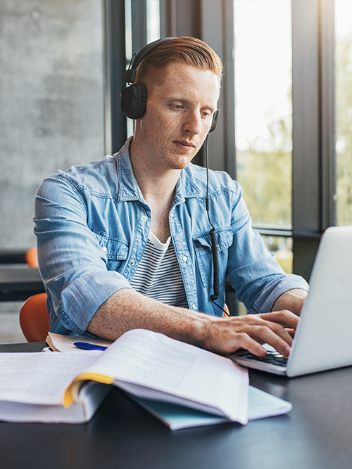 image of college student studying on laptop